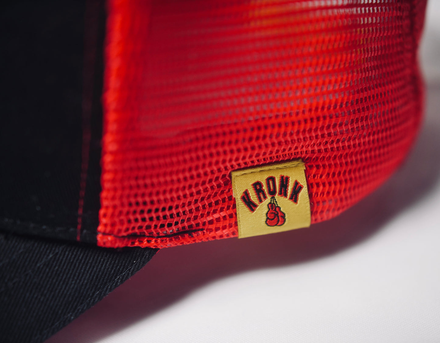 KRONK WAR Trucker Cap: Black with Red Mesh and Red & Yellow Towelling Embroidery