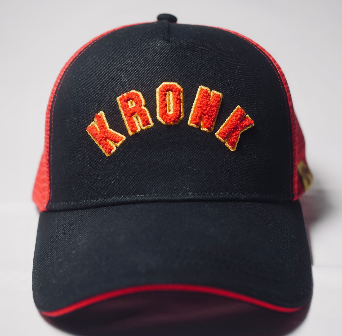 KRONK WAR Trucker Cap: Black with Red Mesh and Red & Yellow Towelling Embroidery