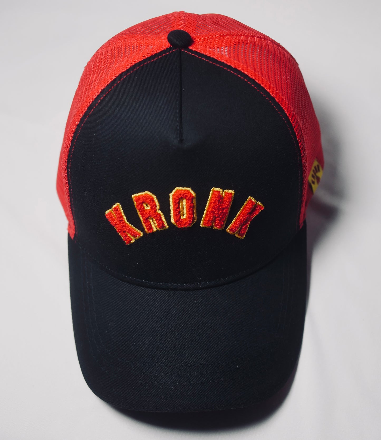 KRONK WAR Trucker Cap: Black with Red Mesh and Red & Yellow Towelling Embroidery