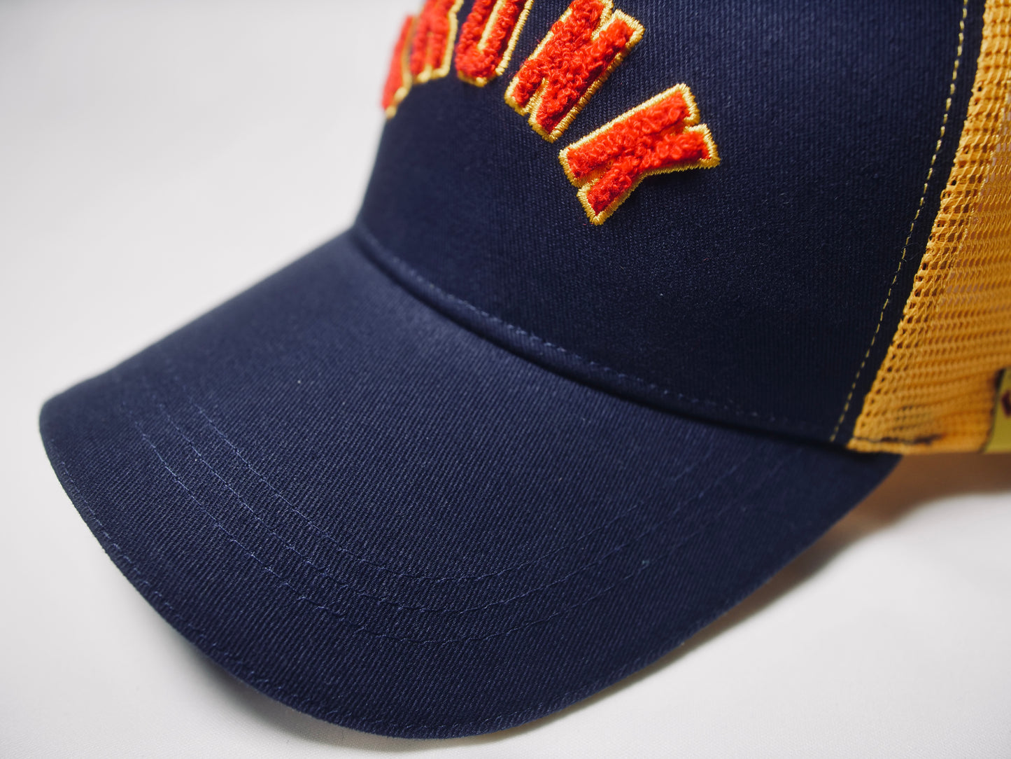 KRONK WAR Trucker Cap: Navy with Yellow Mesh and Red & Yellow Towelling Embroidery