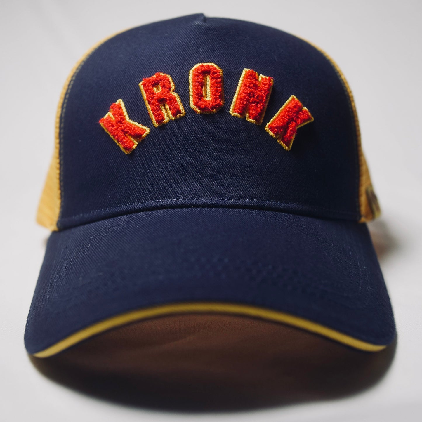 KRONK WAR Trucker Cap: Navy with Yellow Mesh and Red & Yellow Towelling Embroidery