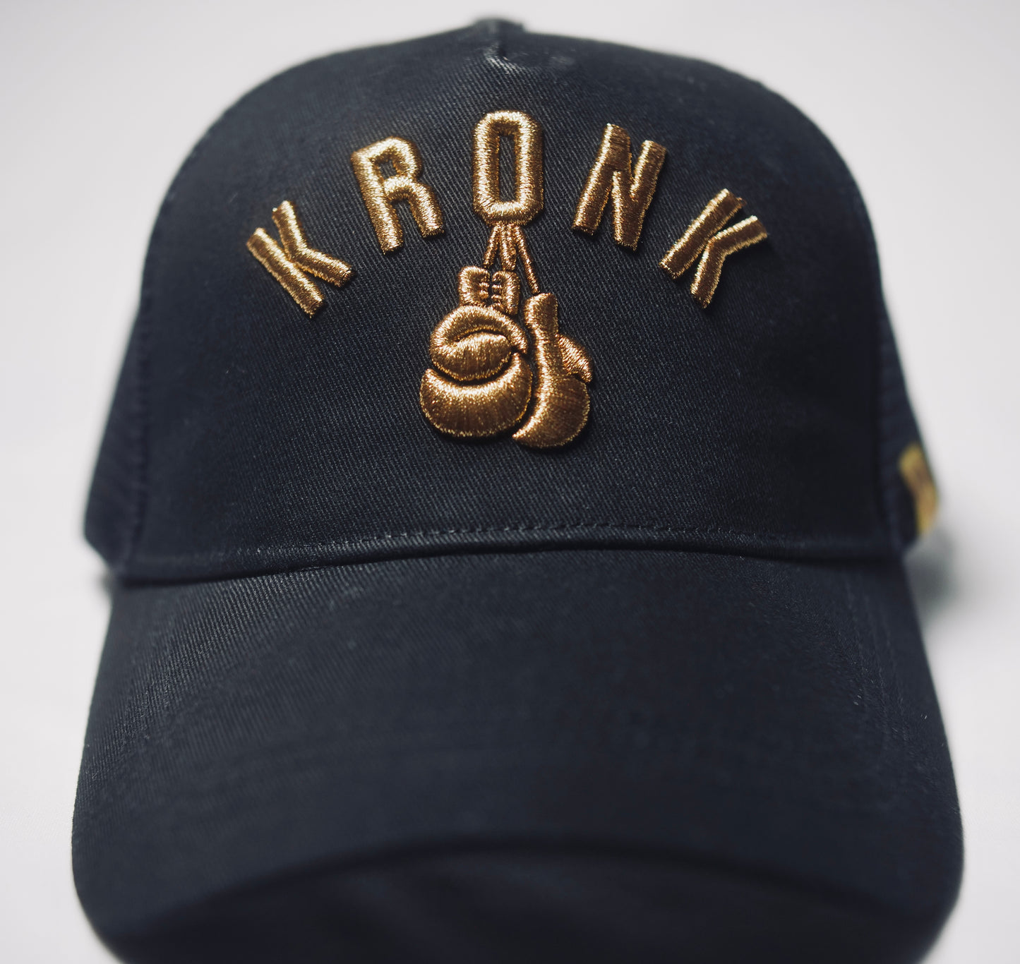 KRONK Olympic Trucker Cap: Black with 3D Gold Embroidery