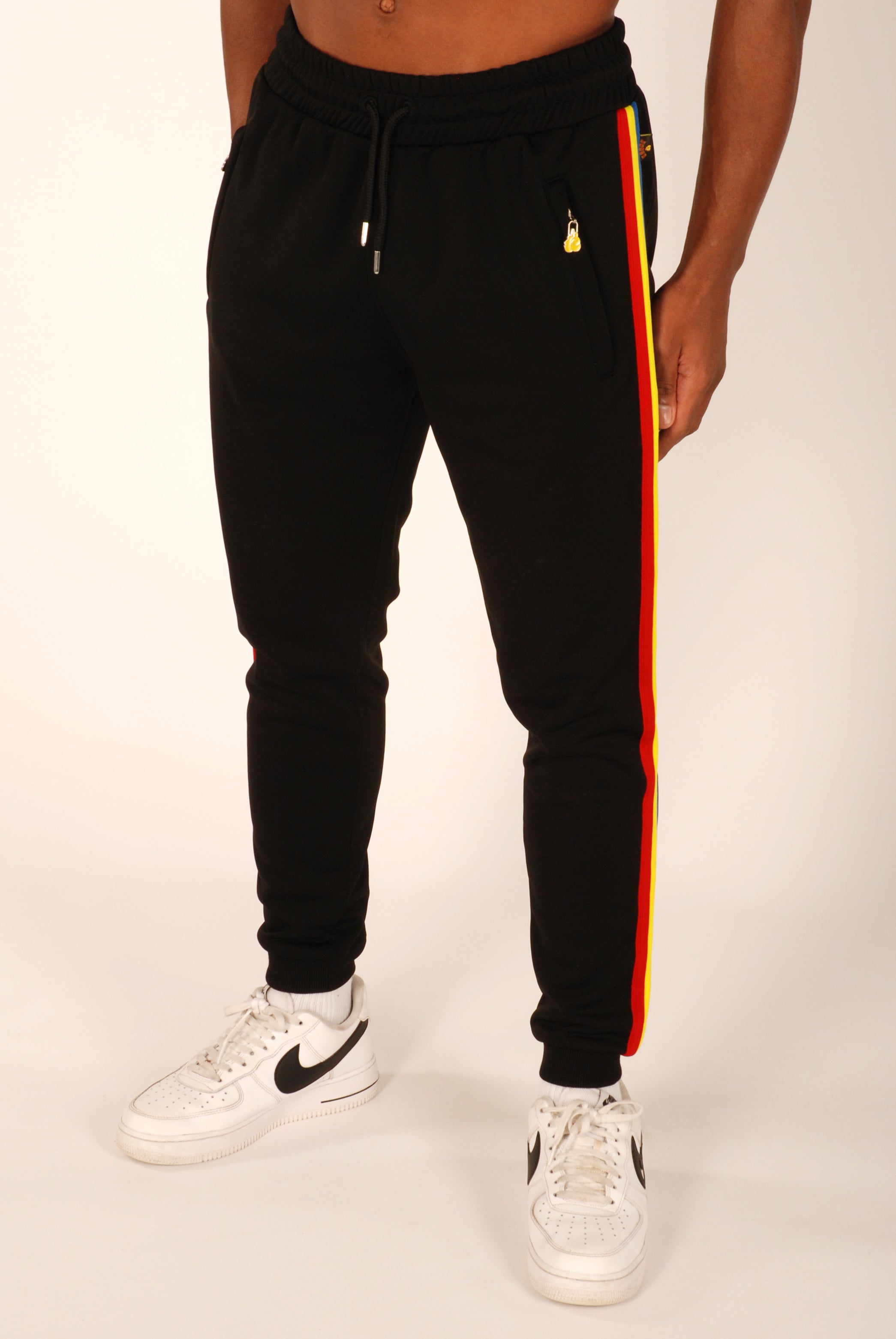 Black joggers store with orange stripe