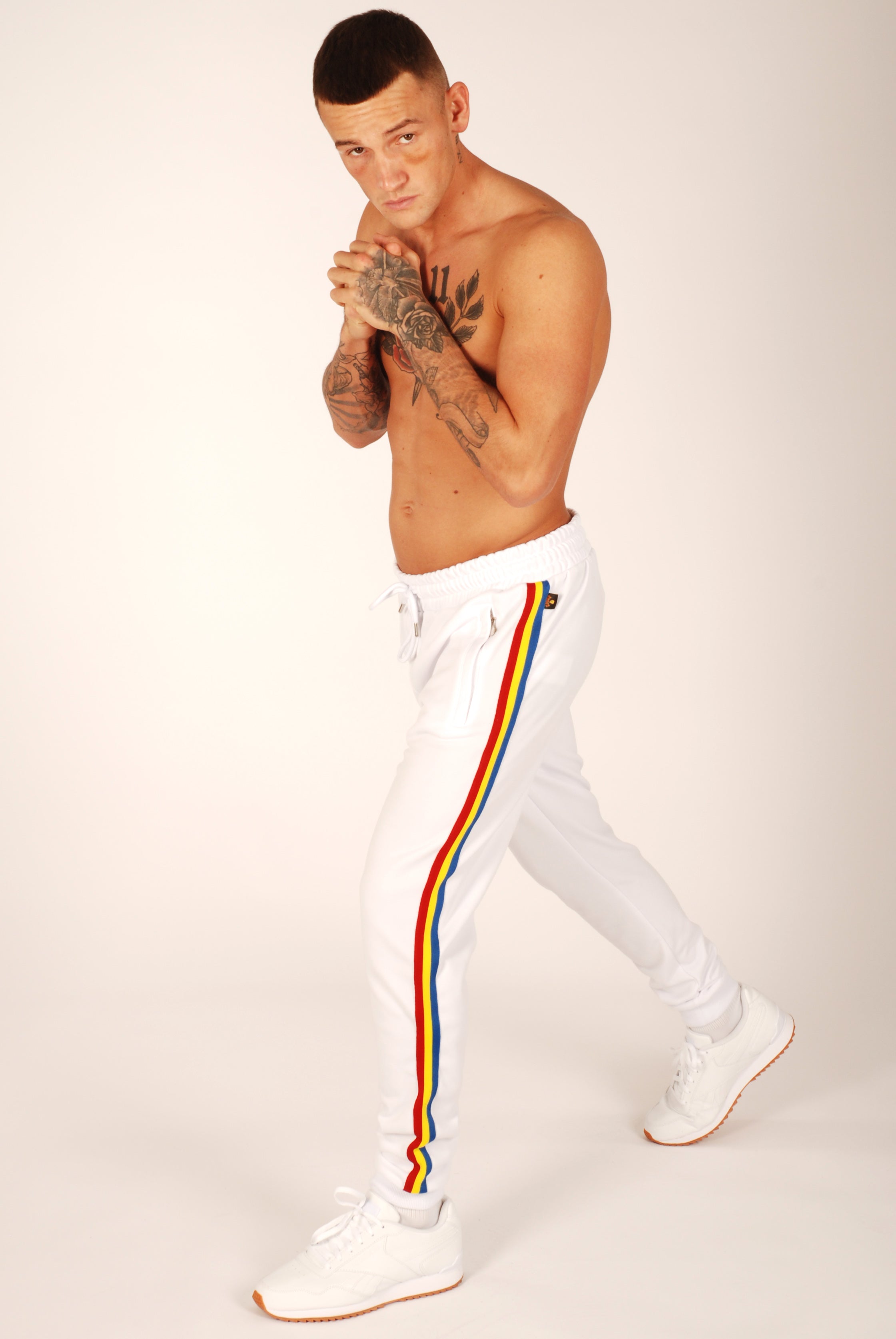 Joggers with best sale white stripe